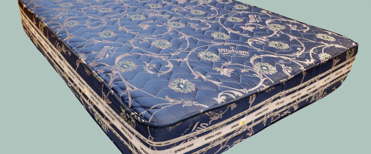A Vitafoam mattress lying on a surface